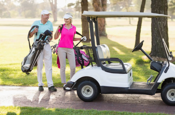 older couple playing golf